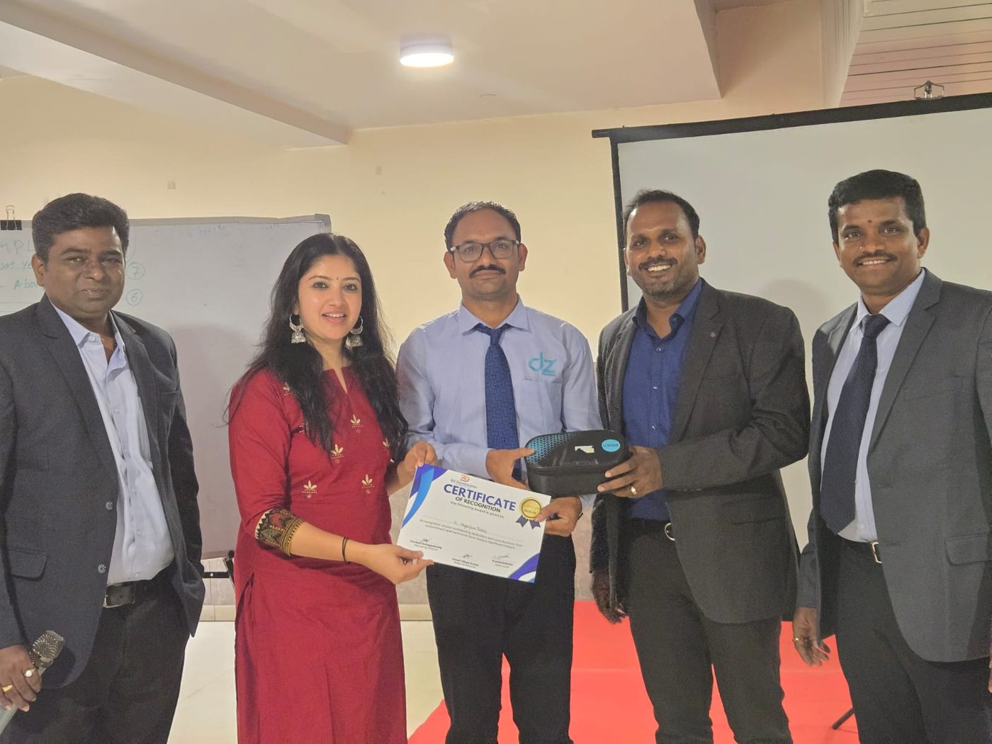 A certificate being presented on stage during the launch ceremony