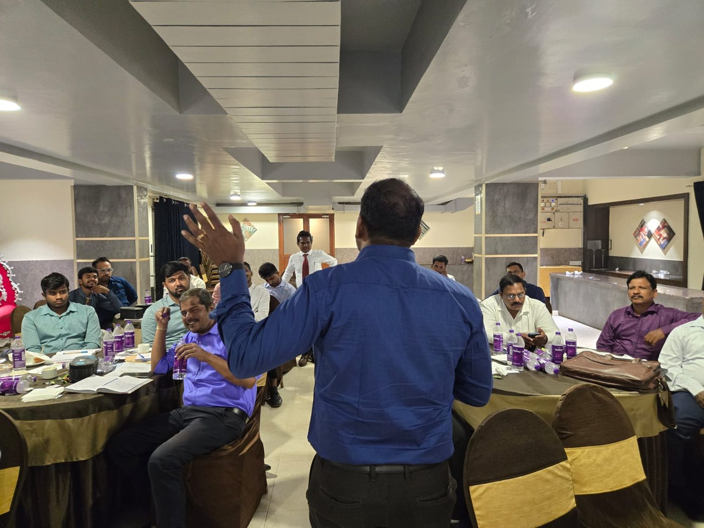 A presenter interacting with the audience during a session